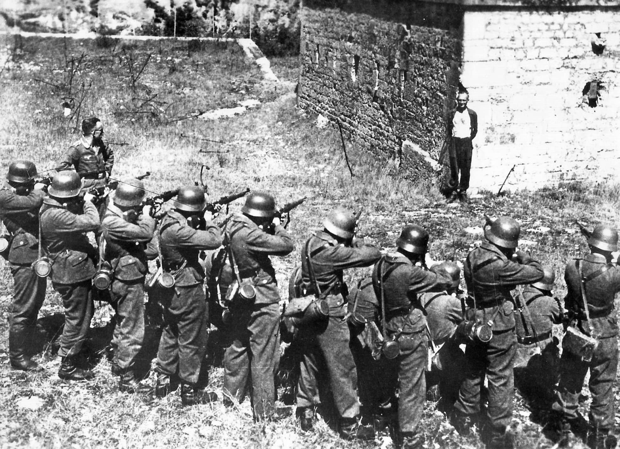 “A member of the French resistance, smiling at a German firing squad in 1944.”